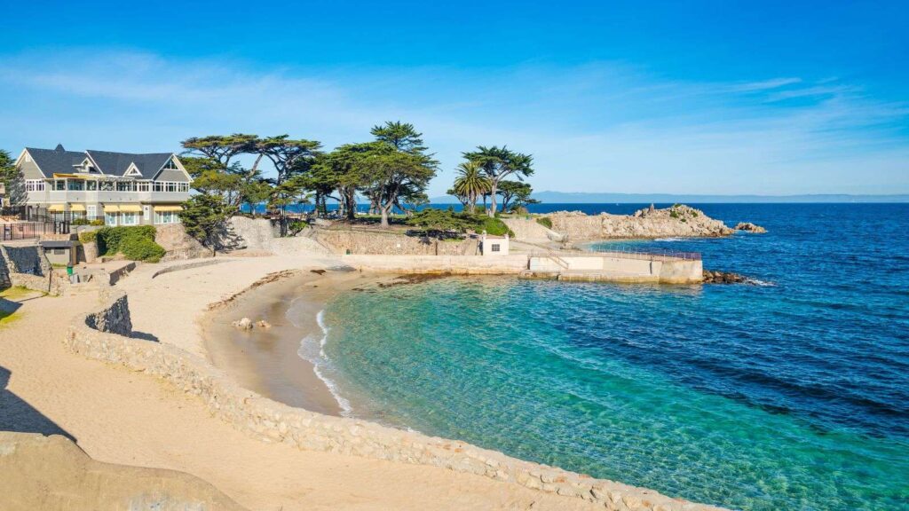 Sandy cove and rocky shoreline in Pacific Grove, the closest city to Monterey, CA