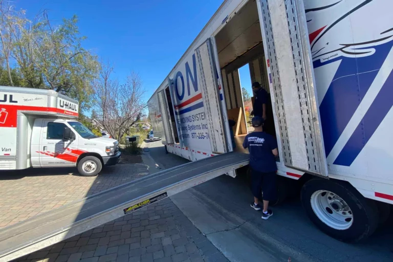 Southbay crew loading a moving truck from a ramp in a residential driveway